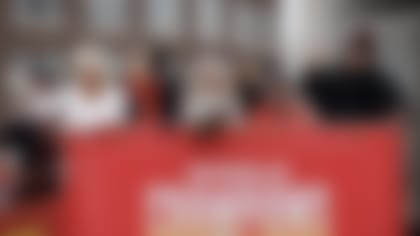 Kansas City Chiefs owner Clark Hunt, second left, and head coach Andy Reid, right, take part in the NFL football team's victory celebration and parade in Kansas City, Mo., Wednesday, Feb. 15, 2023, following the Chiefs' win over the Philadelphia Eagles Sunday in the NFL Super Bowl 57 football game. (AP Photo/Colin E. Braley)