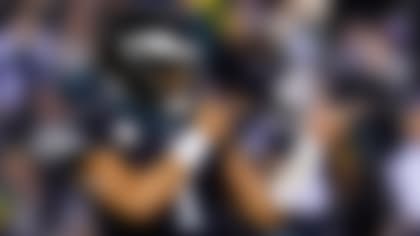 FILE — Philadelphia Eagles quarterback Jalen Hurts celebrates a touchdown run by Kenneth Gainwell during the first half of the team's NFL football game against the Green Bay Packers on Nov. 27, 2022, in Philadelphia. Jalen Hurts is set to sign one of the richest deals in NFL history, agreeing to a five-year, $255 million extension with the Philadelphia Eagles, including $179.3 million guaranteed, a person with knowledge of the situation told The Associated Press. The Eagles announced on Monday, April 17,  “QB1 is here to stay,” but terms were not yet announced, according to the person who spoke to the AP on condition of anonymity because the deal was not yet final. (AP Photo/Chris Szagola, File)