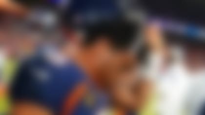 Denver Broncos quarterback Russell Wilson (3) removes his helmet after a concussion against the Kansas City Chiefs during the second half of an NFL football game, Sunday, Dec. 11, 2022, in Denver. (AP Photo/Jack Dempsey)