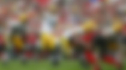 Green Bay Packers quarterback Aaron Rodgers (12) uses hand signals against the Tampa Bay Buccaneers during an NFL football game Sunday, Dec. 21, 2014, in Tampa, Fla. The Packers won 20-3. (Jeff Haynes/AP Images for Panini)