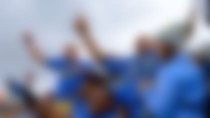 UCLA players celebrate their 38-28 victory over USC at the Rose Bowl on Saturday.
