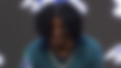 Baltimore Ravens head coach John Harbaugh and quarterback Lamar Jackson speak during a news conference at the NFL football team's training center, Thursday, May 4, 2023, in Owings Mills, Md. (AP Photo/Julia Nikhinson)