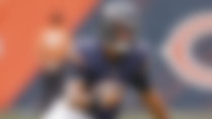 Chicago Bears quarterback Justin Fields (1) runs with the ball against the Buffalo Bills during the second half of a preseason NFL football game, Saturday, Aug. 21, 2021, in Chicago. (AP Photo/Kamil Krzaczynski)