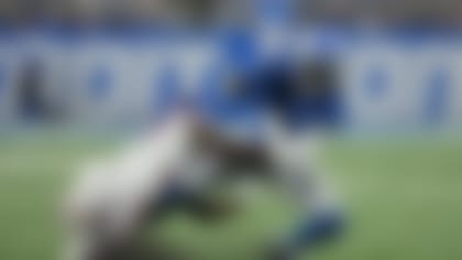 New York Giants cornerback Tre Hawkins III tackles Detroit Lions wide receiver Jameson Williams (9) during the first half of an NFL preseason football game, Friday, Aug. 11, 2023, in Detroit. (AP Photo/Paul Sancya)