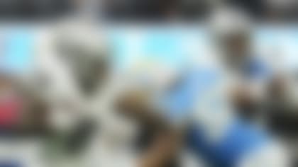 Las Vegas Raiders running back Josh Jacobs (8) runs past linebacker Khalil Mack (52) during the first half of an NFL football game Sunday, Oct. 1, 2023, in Inglewood, Calif. (AP Photo/Ashley Landis)