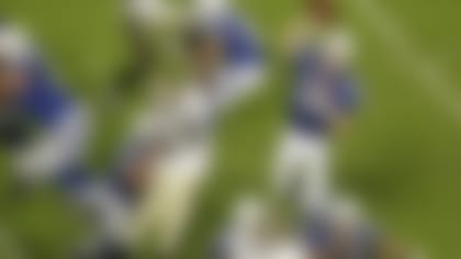 Indianapolis Colts quarterback Peyton Manning (18) throws under pressure from New Orleans Saints defensive end Anthony Hargrove (69) during the first half of the NFL Super Bowl XLIV football game in Miami, Sunday, Feb. 7, 2010. (AP Photo/Charlie Riedel)