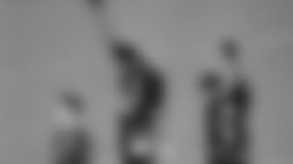 FILE -  In this Oct. 16, 1968 file photo, United States athletes Tommie Smith, top center, and John Carlos, top right, extend their gloved fists skyward during the playing of the "Star-Spangled Banner" after Smith received the gold and Carlos the bronze for the 200-meter run at the Summer Olympic Games in Mexico City. Australia's silver medalist Peter Norman is at left. When Tommie Smith bowed his head and thrust a black-gloved fist toward the sky from the top of the Olympic podium 45 years ago, he was making a personal statement about human rights. With questions swirling over an anti-gay law in Russia, which will host the Winter Games in Sochi in February, today's athletes face a similar choice, Smith told The Associated Press Sunday, Sept. 8, 2013, at a track and field meet in Rieti, Italy. (AP Photo/File)