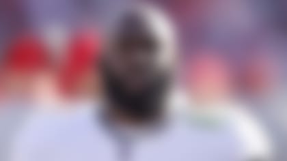 Tampa Bay Buccaneers running back Leonard Fournette (7) watches from the sideline during an NFL divisional playoff football game against the Los Angeles Rams, Sunday, Jan. 23, 2022, in Tampa, Fla. The Rams defeated the Buccaneers 30-27. (Joe Robbins via AP)