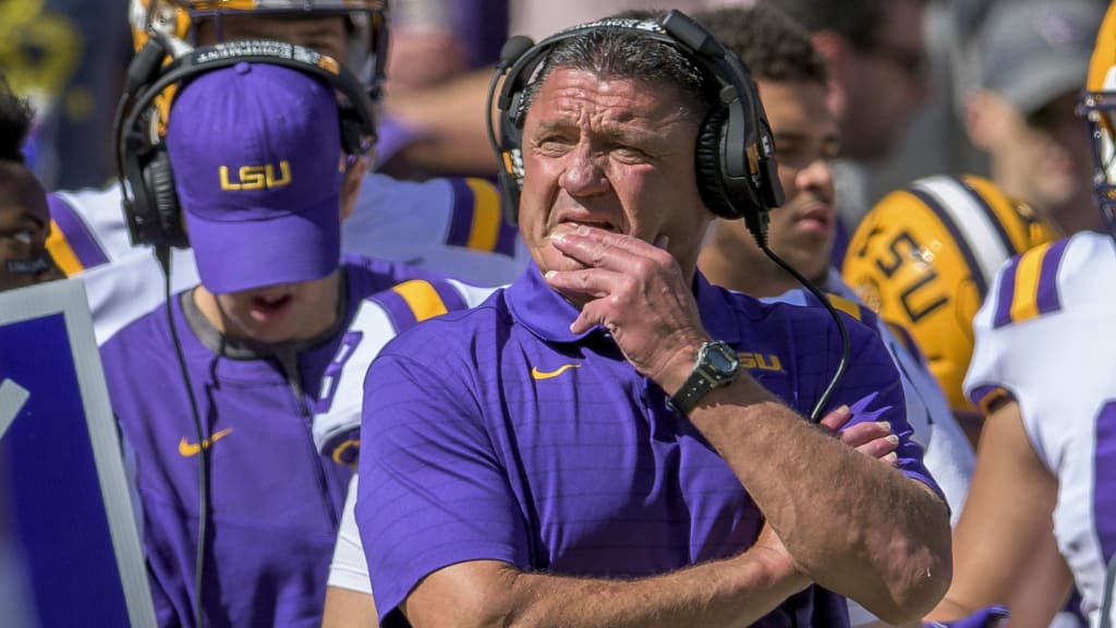 Former LSU head football coach, Ed Orgeron, right, talks to his girlfriend  Bailie Lauderdale during the third quarter of an NCAA college football game  between Texas A&M and Miami on Saturday, Sept.