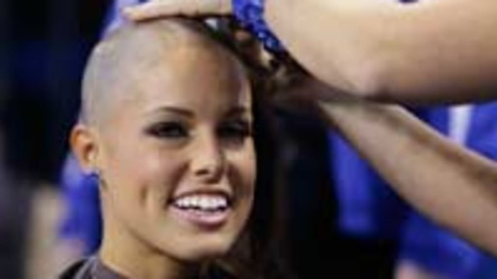 NFL cheerleaders shave heads to support coach