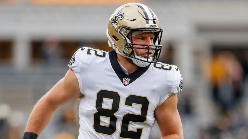 New Orleans Saints tight end Adam Trautman (82) runs the ball up