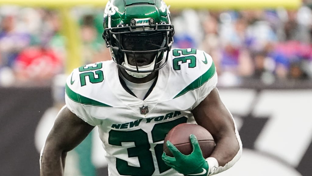 New York Jets running back Michael Carter (32) is tackled during