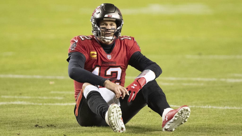 Tom Brady of the Tampa Bay Buccaneers avoids a sack during an NFL