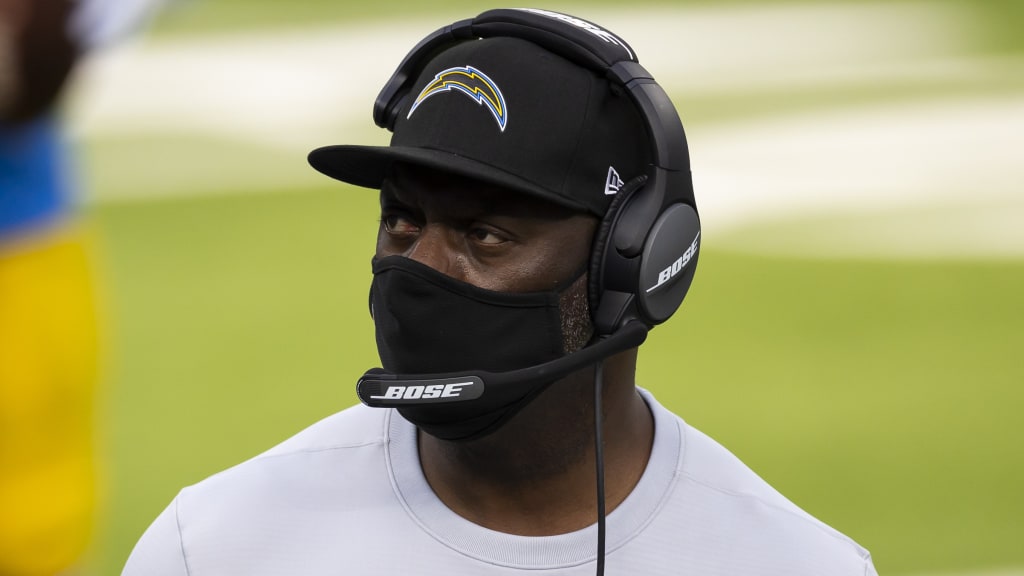 Los Angeles Chargers head coach Anthony Lynn wears a face shield and a  Salute to Service shirt on the field before the Los Angeles Chargers take  on the Miami Dolphins during an