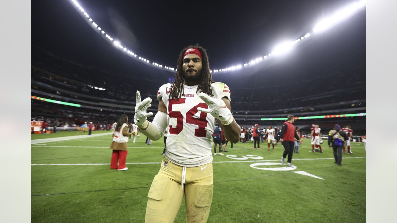 San Francisco 49ers linebacker Fred Warner wears cleats in honor of Mexico  during the first half of an NFL football game against the Arizona  Cardinals, Monday, Nov. 21, 2022, in Mexico City. (