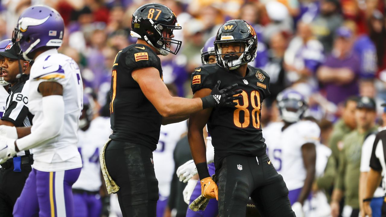 Washington Commanders tight end John Bates (87) celebrates his