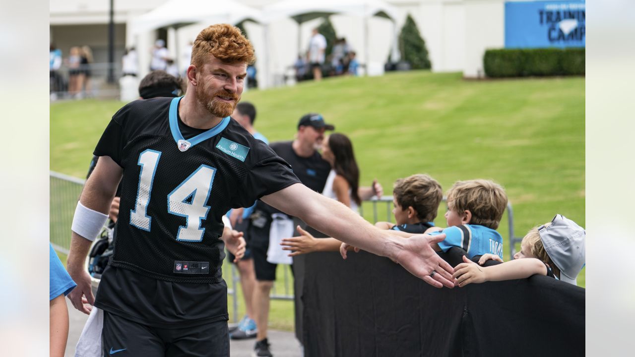 Member of the US military holds up the signed practice worm jersey of  Philadelphia Eagles quarterback Jalen Hurts for the Back Together  Saturday during practice at NFL football training camp, Saturday, July