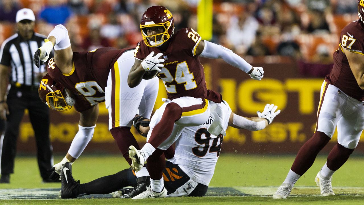 Washington Commanders running back Antonio Gibson (24) runs with the ball  during the first half of an NFL football game against the Atlanta Falcons,  Sunday, Nov. 27, 2022, in Landover, Md. (AP