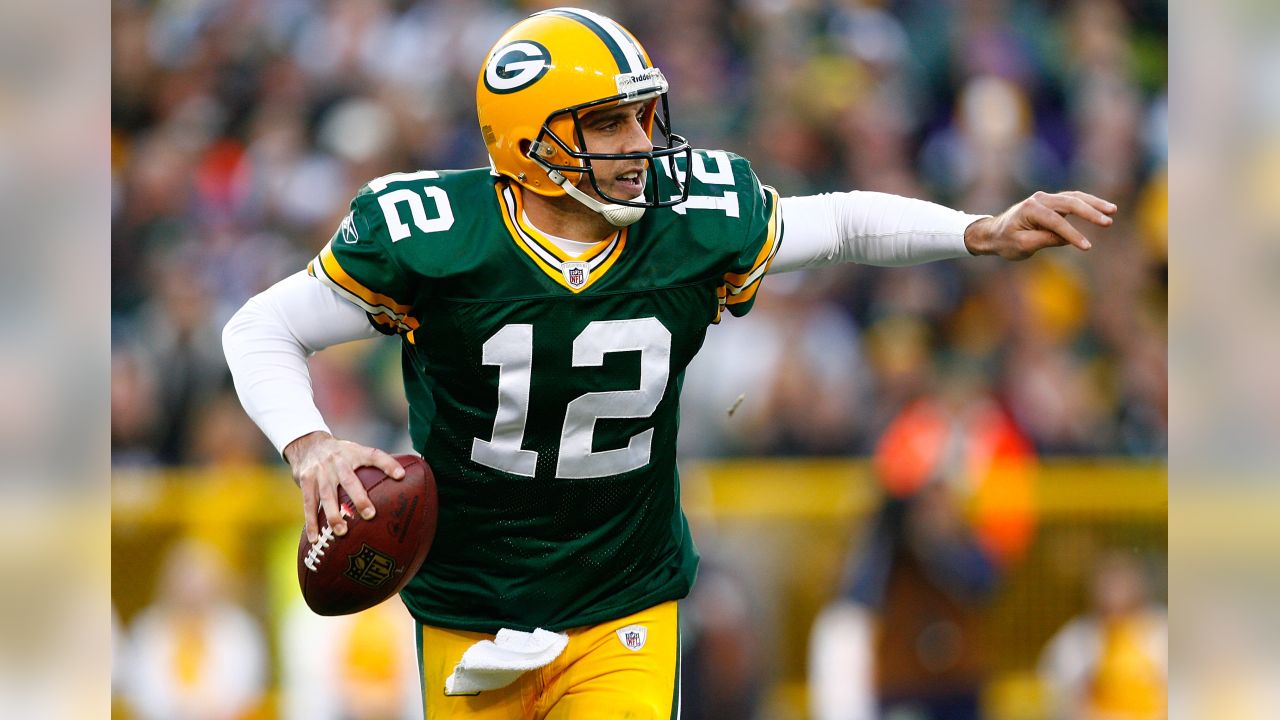 GREEN BAY, WI - OCTOBER 16: Green Bay Packers quarterback Aaron Rodgers  (12) drops to pass during a game between the Green Bay Packers and the New  York Jets at Lambeau Field