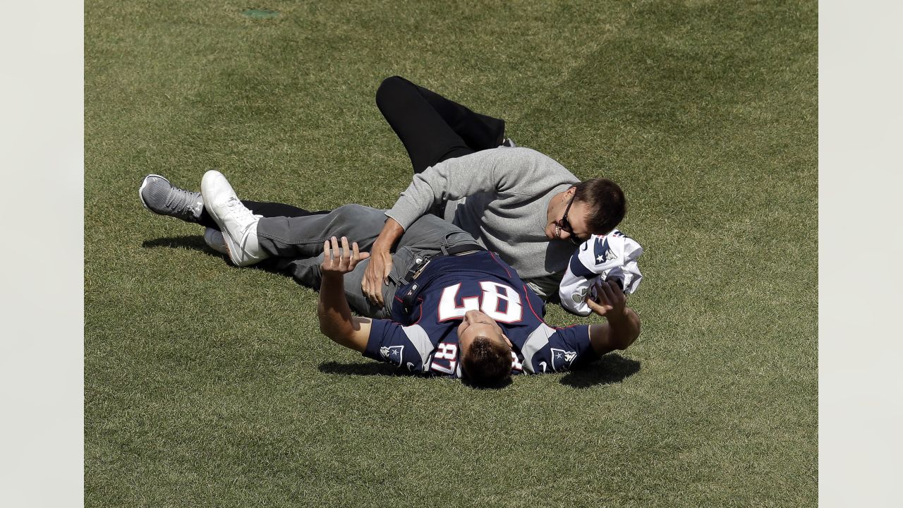 New England Patriots rookie tight end Rob Gronkowski grabs his first NFL  touchdown catch, next to Cincinnati Bengals linebacker Dhani Jones, during  the second half of New England's 38-24 win in an