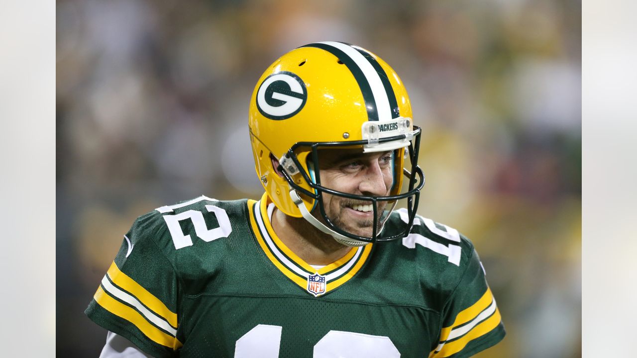 October 24, 2021: Green Bay Packers quarterback Aaron Rodgers #12 warms up  before the NFL football game between the Washington Football Team and the Green  Bay Packers at Lambeau Field in Green