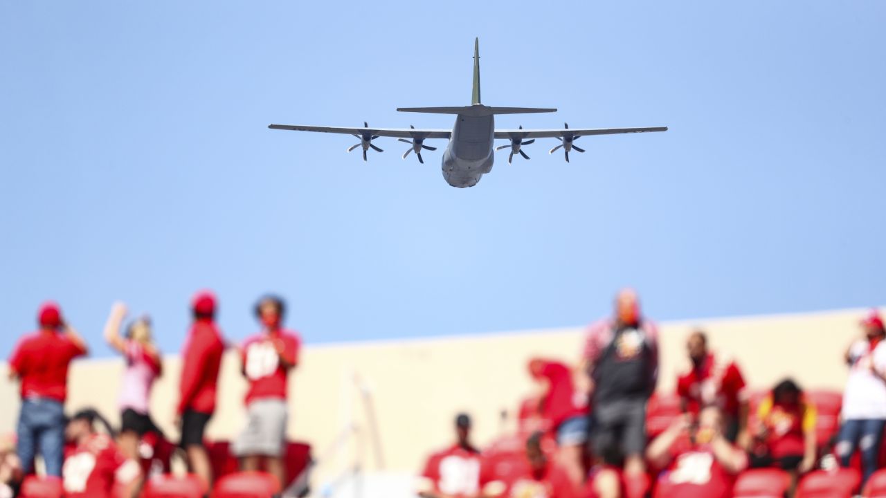 Tampa Bay Buccaneers fans react as a military flyover proceded over the  stadium at the conclusion of the national Anthem before an NFL football  game between the Tampa Bay Buccaneers and the