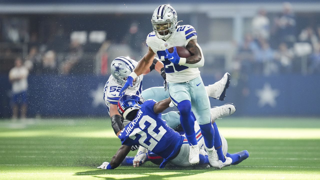 Dallas Cowboys running back Tony Pollard escapes a tackle attempt