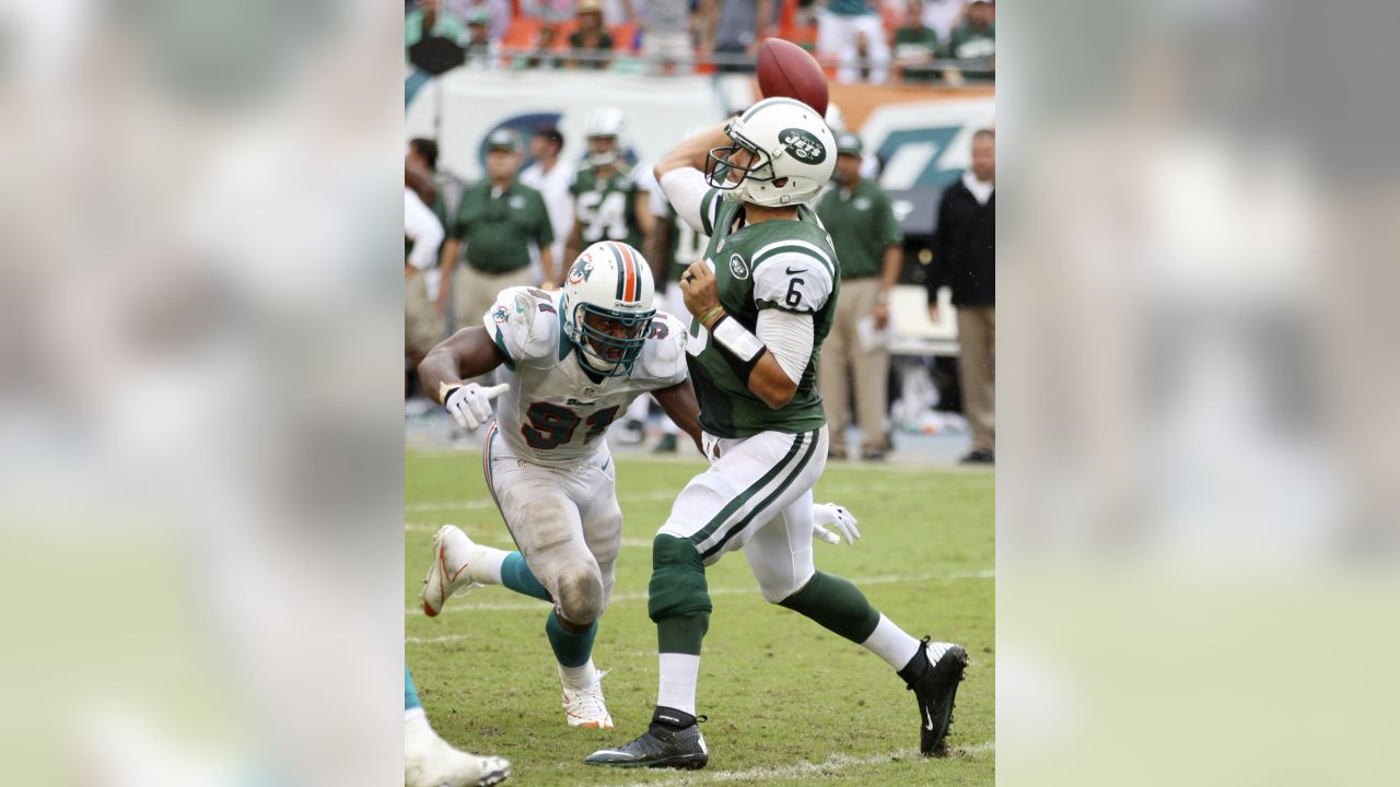 Miami Dolphins linebacker Cameron Wake looks on from the bench during the  fourth quarter of an NFL football game against the Chicago Bears, Thursday,  Nov. 18, 2010 in Miami. The Bears defeated