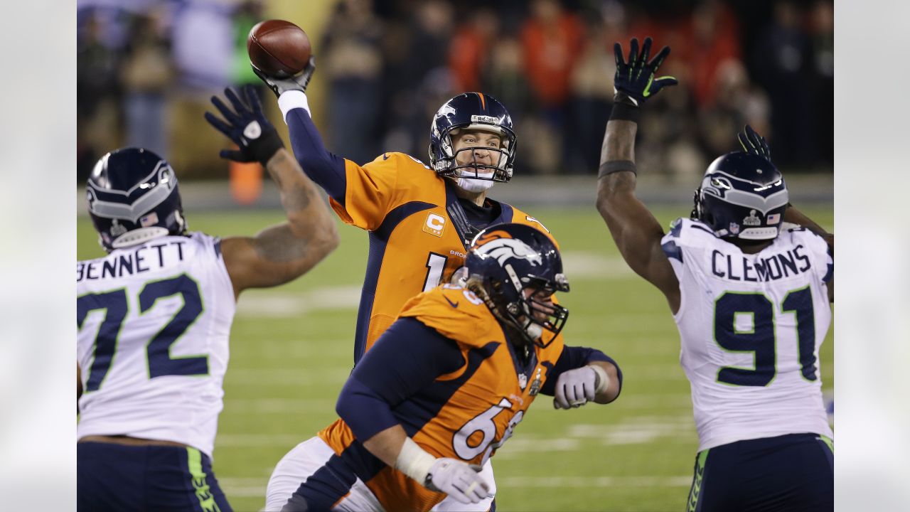 Denver Broncos quarterback Peyton Manning (18) looks to throw a pass  against the Seattle Seahawks at the Super Bowl XLVIII at MetLife Stadium in  East Rutherford, New Jersey on February 2, 2014.