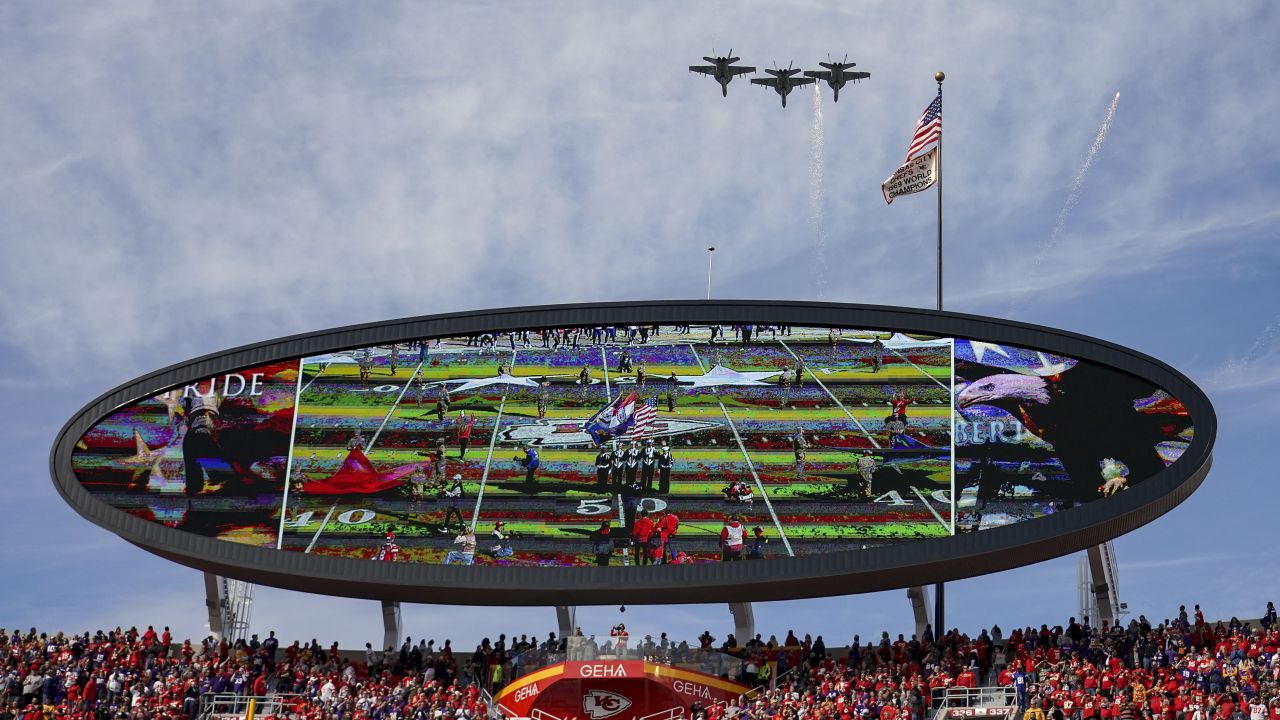 First responders carry an American flag from the field before an NFL  football game between the Buffalo Bills and Kansas City Chiefs at Arrowhead  Stadium in Kansas City, Mo., Sunday, Sept. 11