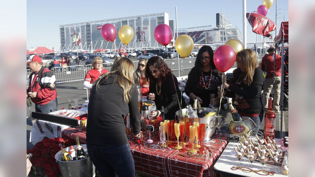 Fans tailgate before an NFL football game between the Atlanta