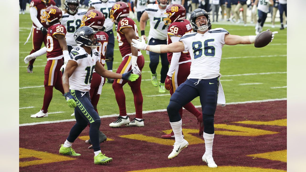 Seattle Seahawks quarterback Russell Wilson (3) greets tight end Jacob  Hollister, center, after Wilson passed to Hollister for touchdown against  the Tampa Bay Buccaneers during the first half of an NFL football