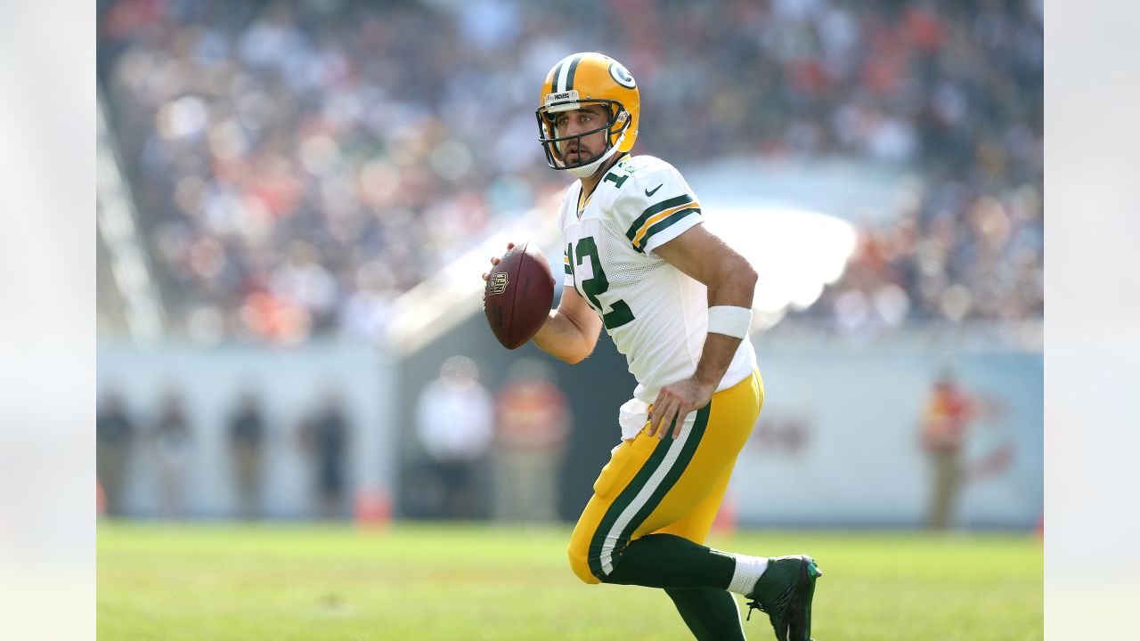 Green Bay Packers quarterback Aaron Rodgers (12) looks to pass the ball  against the Chicago Bears during the first half of an NFL football game,  Sunday, Dec. 4, 2022, in Chicago. (AP