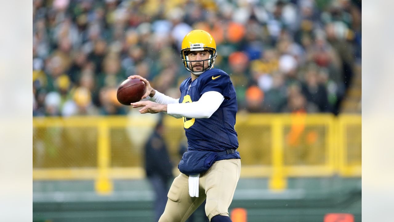 GREEN BAY, WI - OCTOBER 16: Green Bay Packers quarterback Aaron Rodgers  (12) drops to pass during a game between the Green Bay Packers and the New  York Jets at Lambeau Field