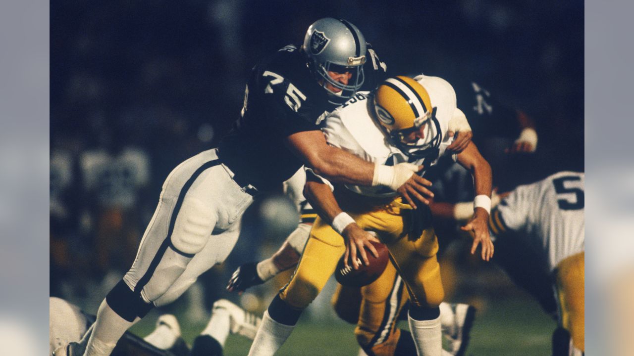 Los Angeles Raiders' Howie Long (75) takes down Green Bay Packers Randy  Wright in Los Angeles, in this September 9, 1984 photo. Long will be  inducted into the Pro Football Hall of