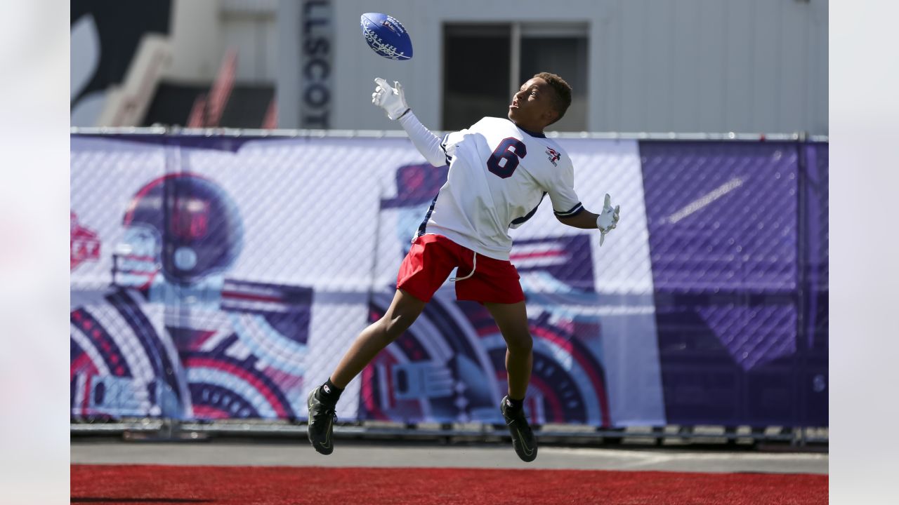 Ohio State wide receiver Garrett Wilson stands with NFL Commissioner Roger  Goodell after being …