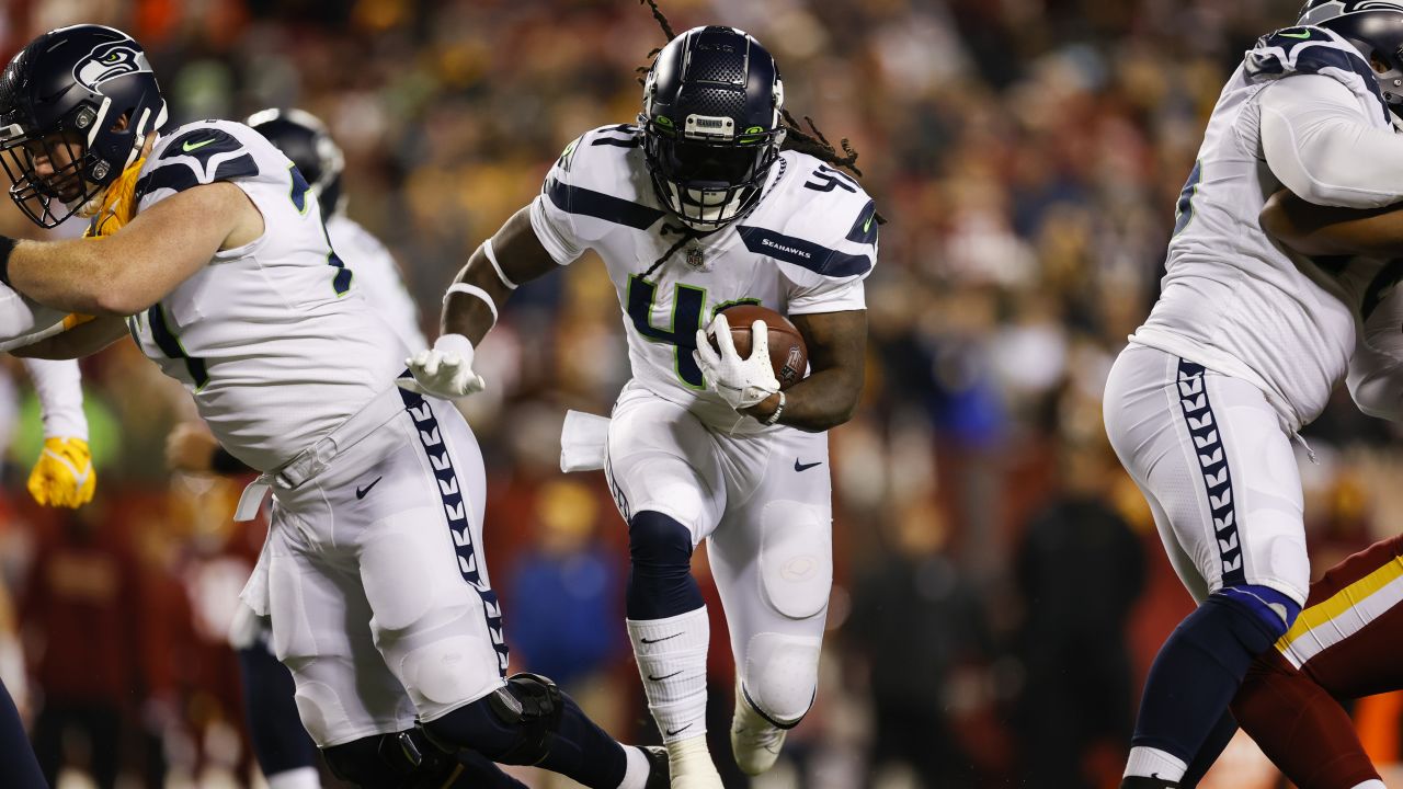 New England Patriots wide receiver Ty Montgomery (14) runs with the ball  during an NFL football game against the Miami Dolphins, Sunday, Sept. 11,  2022, in Miami Gardens, Fla. (AP Photo/Doug Murray