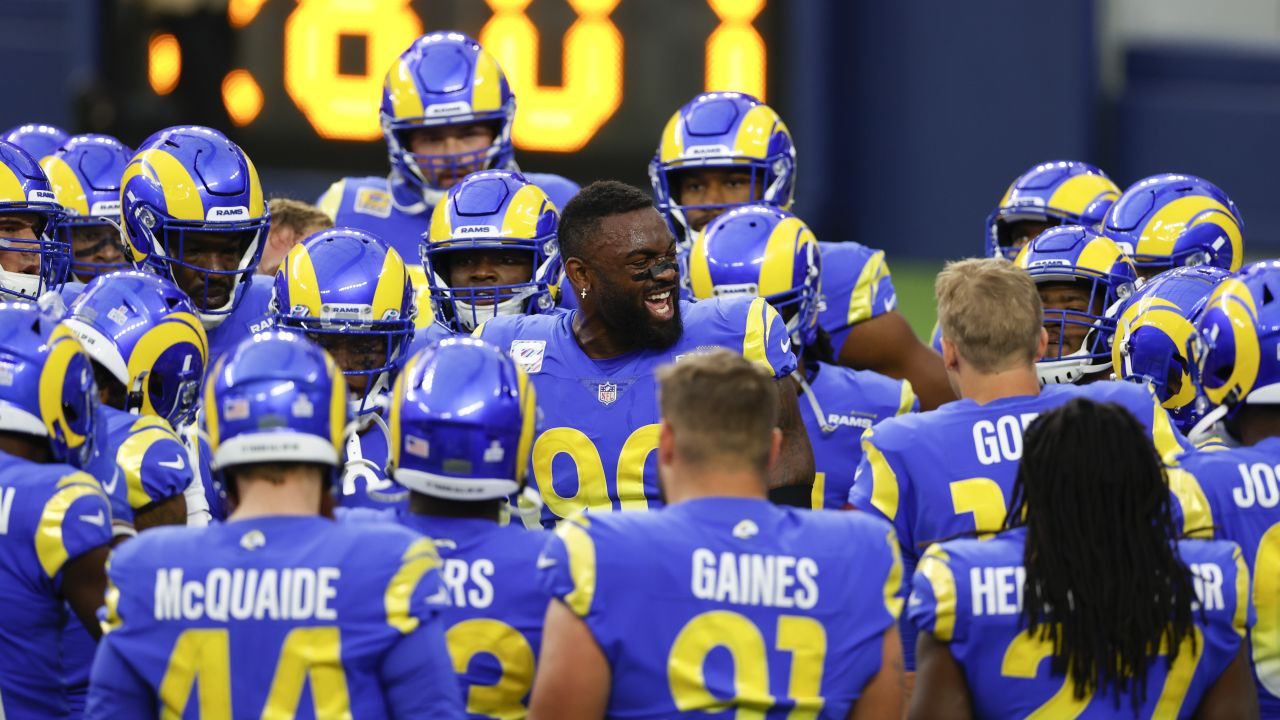 The Los Angeles Rams huddle during the first half of a preseason NFL  football game against the …