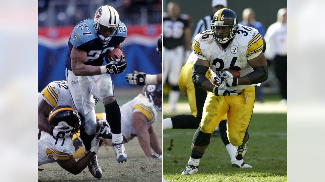 Eddie George of the Tennessee Titans carries the ball during the game