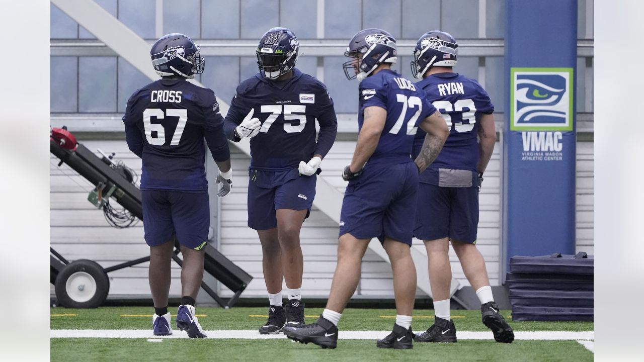 Seattle Seahawks tackle Charles Cross (67) warms up before playing against  the Los Angeles Rams in