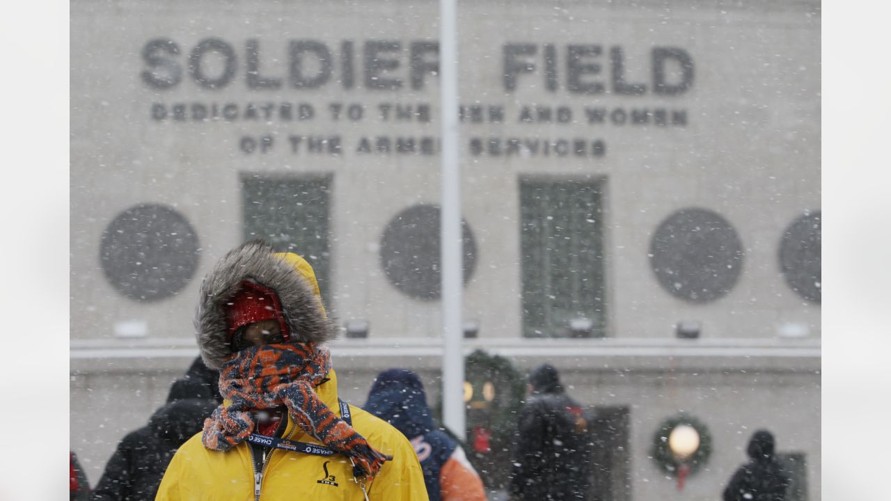 Fans stand bundled up against the cold weather at Soldier Field before an  NFL football game between the Chicago Bears and Green Bay Packers, Sunday,  Dec. 18, 2016, in Chicago. (AP Photo/Nam