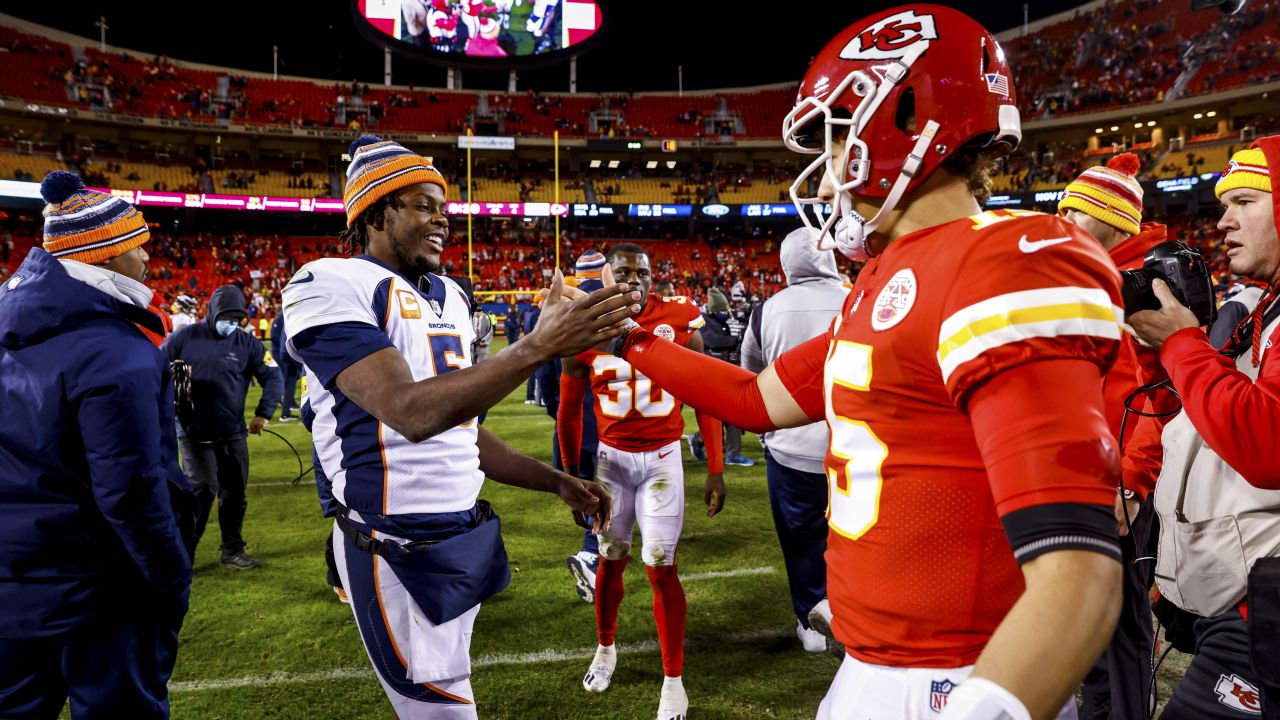 Kansas City Chiefs quarterback Patrick Mahomes (15) is chased by  Jacksonville Jaguars defensive tackle Corey Peters (98) during the second  half of an NFL football game, Sunday, Nov. 13, 2022 in Kansas