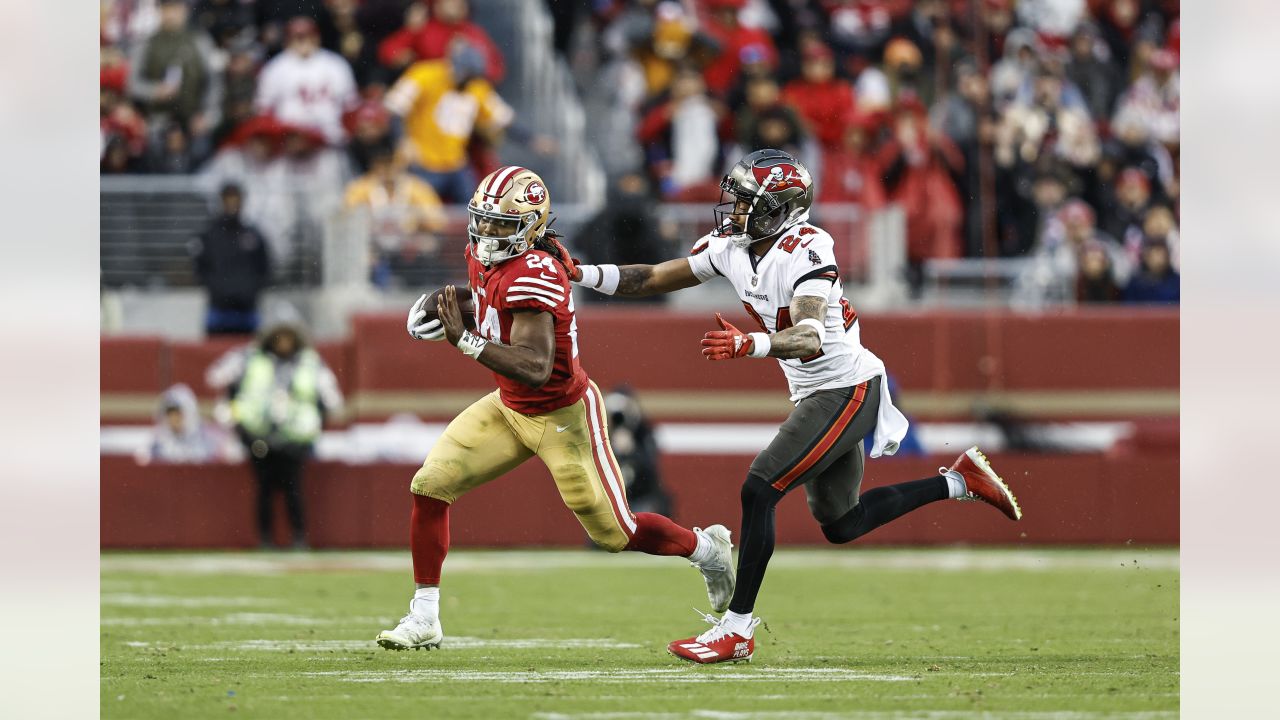 San Francisco 49ers running back Jordan Mason (24) warms up before