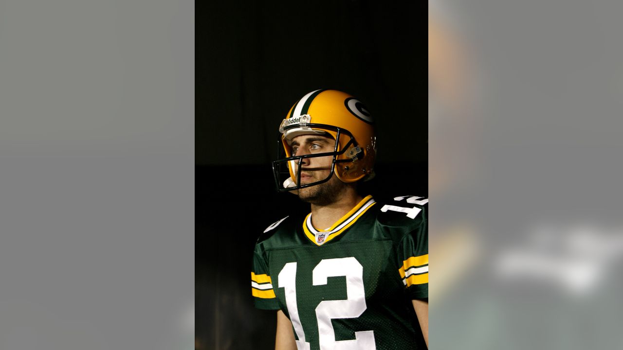 October 24, 2021: Green Bay Packers quarterback Aaron Rodgers #12 warms up  before the NFL football game between the Washington Football Team and the  Green Bay Packers at Lambeau Field in Green