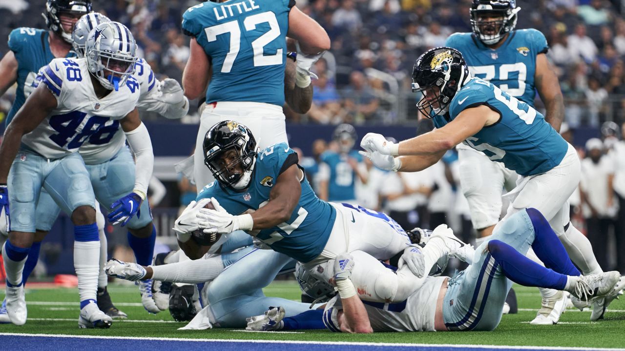 Chicago Bears defensive back Tre Roberson, left, scores a touchdown after  intercepting a pass against the Tennessee Titans in the first half of a  preseason NFL football game Saturday, Aug. 28, 2021