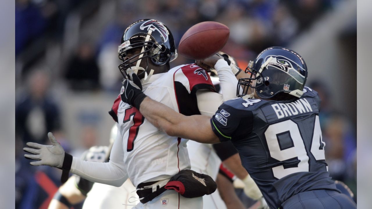 Atlanta Falcons tight end Alge Crumpler (83) is upended by Seattle  Seahawks' Marcus Trufant after a catch for short yardage in the third  quarter of an NFL football game Sunday , Dec.