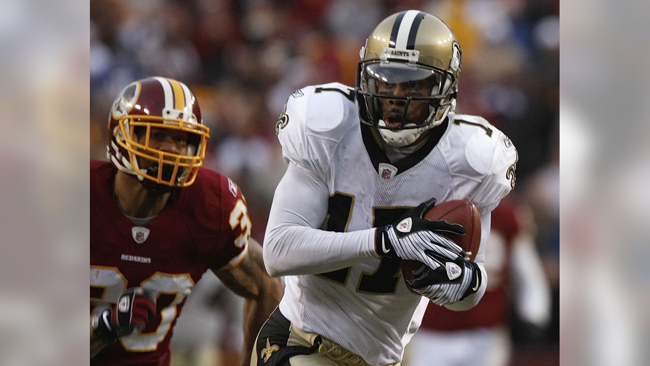 New Orleans Saints Scott Shanle jumps on Marques Colston after