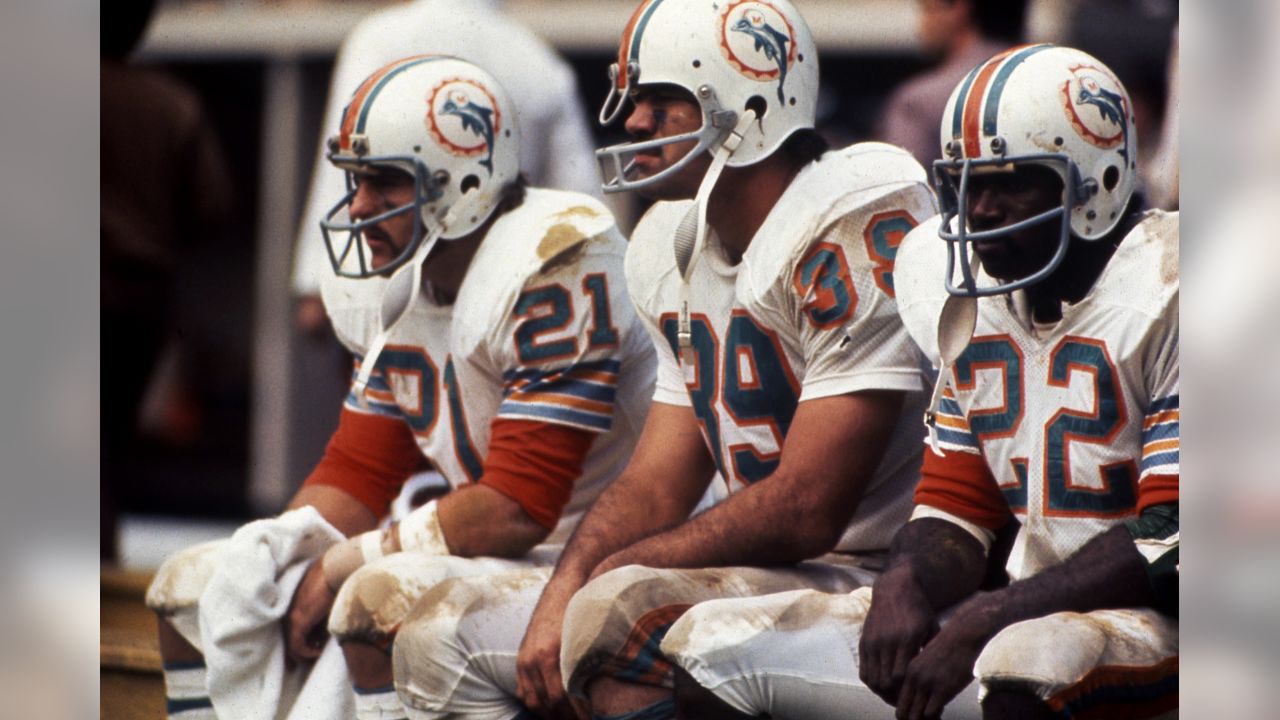 Miami Dolphins fullback Larry Csonka (39) grinds out the yardage in their  game against the Buffalo Bills at The Orange Bowl in Miami, Fla., Oct. 22,  1972. Making the stop in the