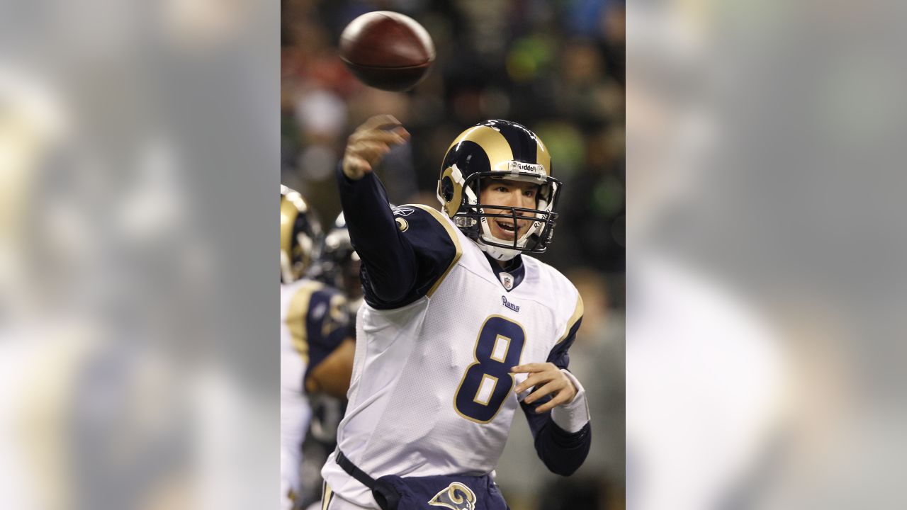 St. Louis Rams quarterback Sam Bradford (8) watches a replay after throwing  an interception for a touchdown against the Detroit Lions in the fourth  quarter of an NFL football game in Detroit