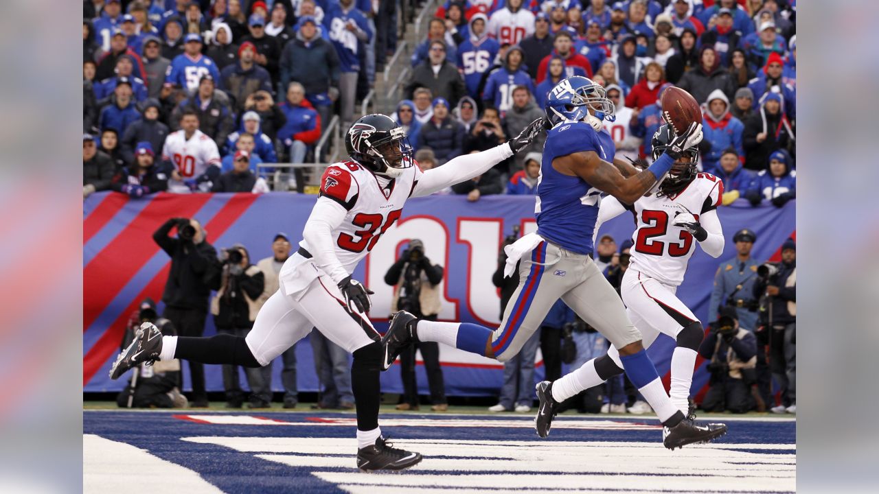 New York Giants running back Brandon Jacobs (27) is brought down by Atlanta  Falcons linebacker Keith Brooking (56) in the second quarter of a football  game Monday, Oct. 15, 2007 in Atlanta. (